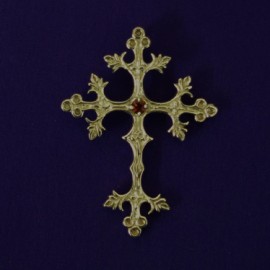 Silver filigree cross with garnet.